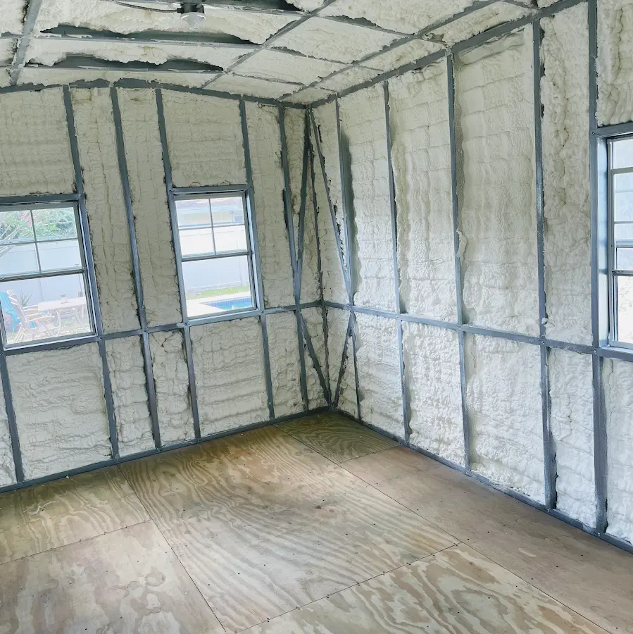 Closed-cell spray foam insulation applied to wall cavities in a residential project in Marlene Village